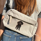 Poodle mix breed on stone coloured cross body bag