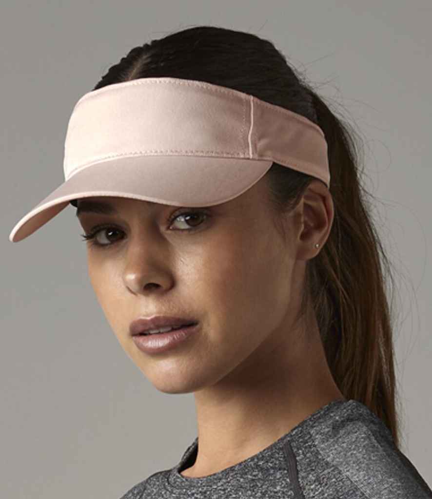 Woman wearing pink visor