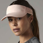 Woman wearing pink visor