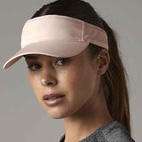 Woman wearing pink visor
