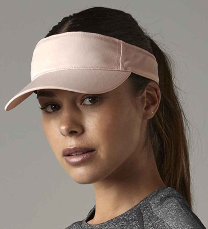 Woman wearing pink visor