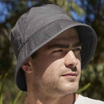 Man wearing graphite bucket hat