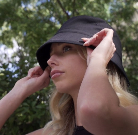 Lady wearing black bucket hat