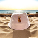 Baby pink bucket hat with terrier dog breed on front 