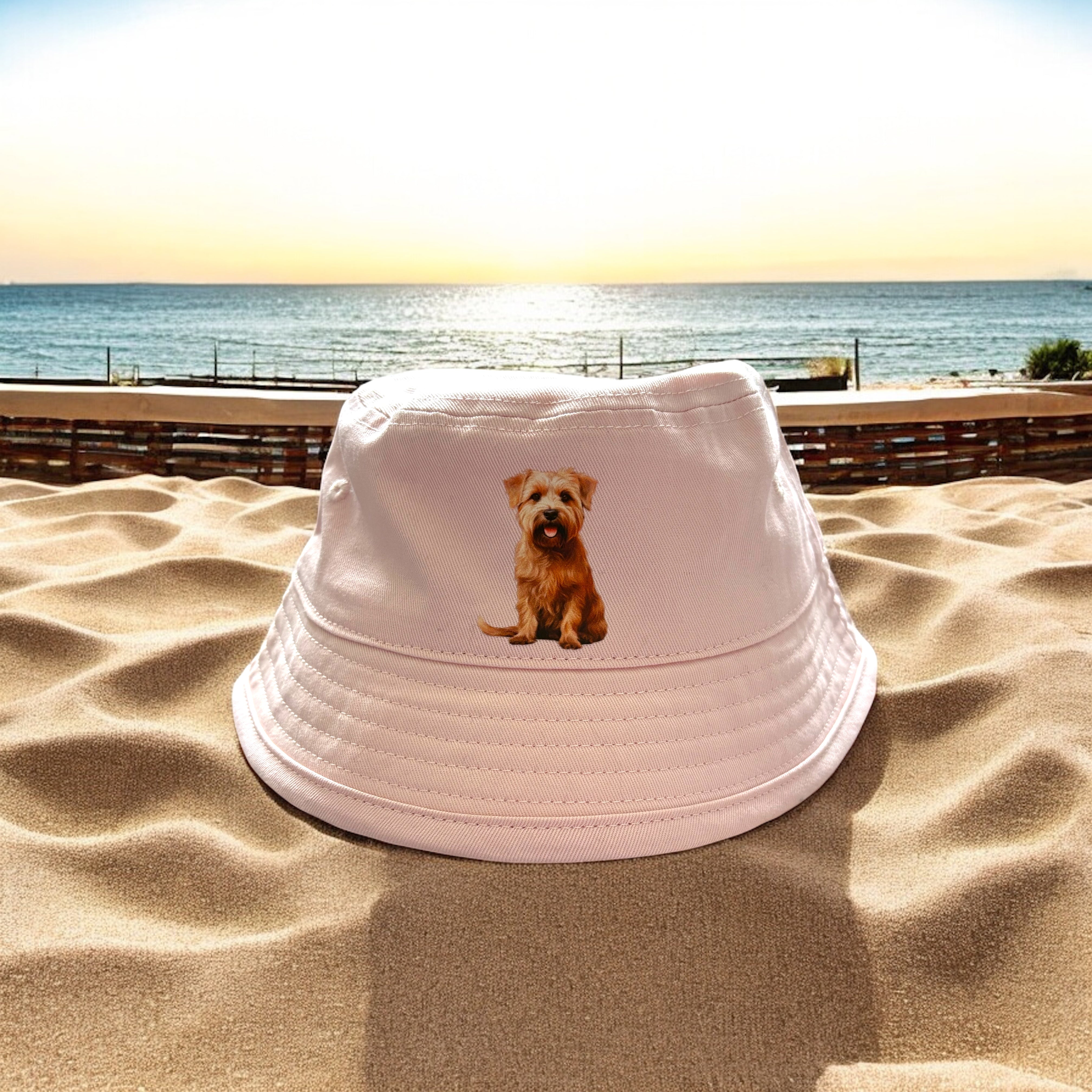 Baby pink bucket hat with terrier dog breed on front 