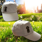 Cap hat with black poodle mix breed on the side 